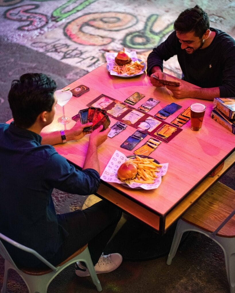Friends playing games and Draughts London